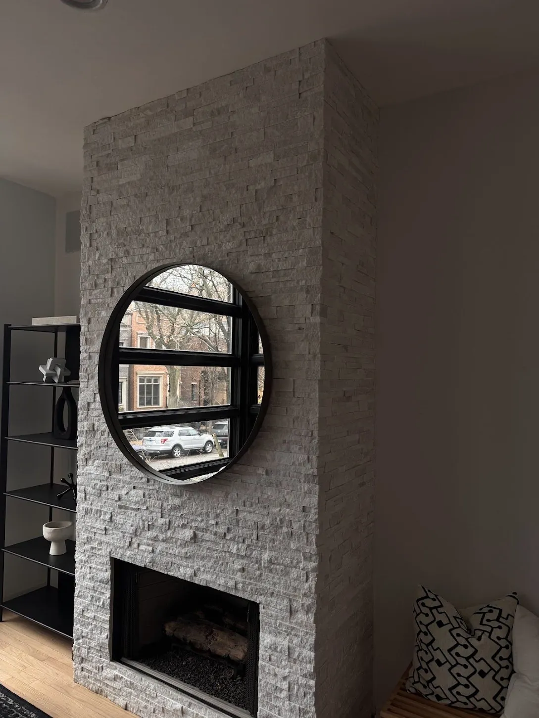 Finished interior with a painted wall and stone fireplace